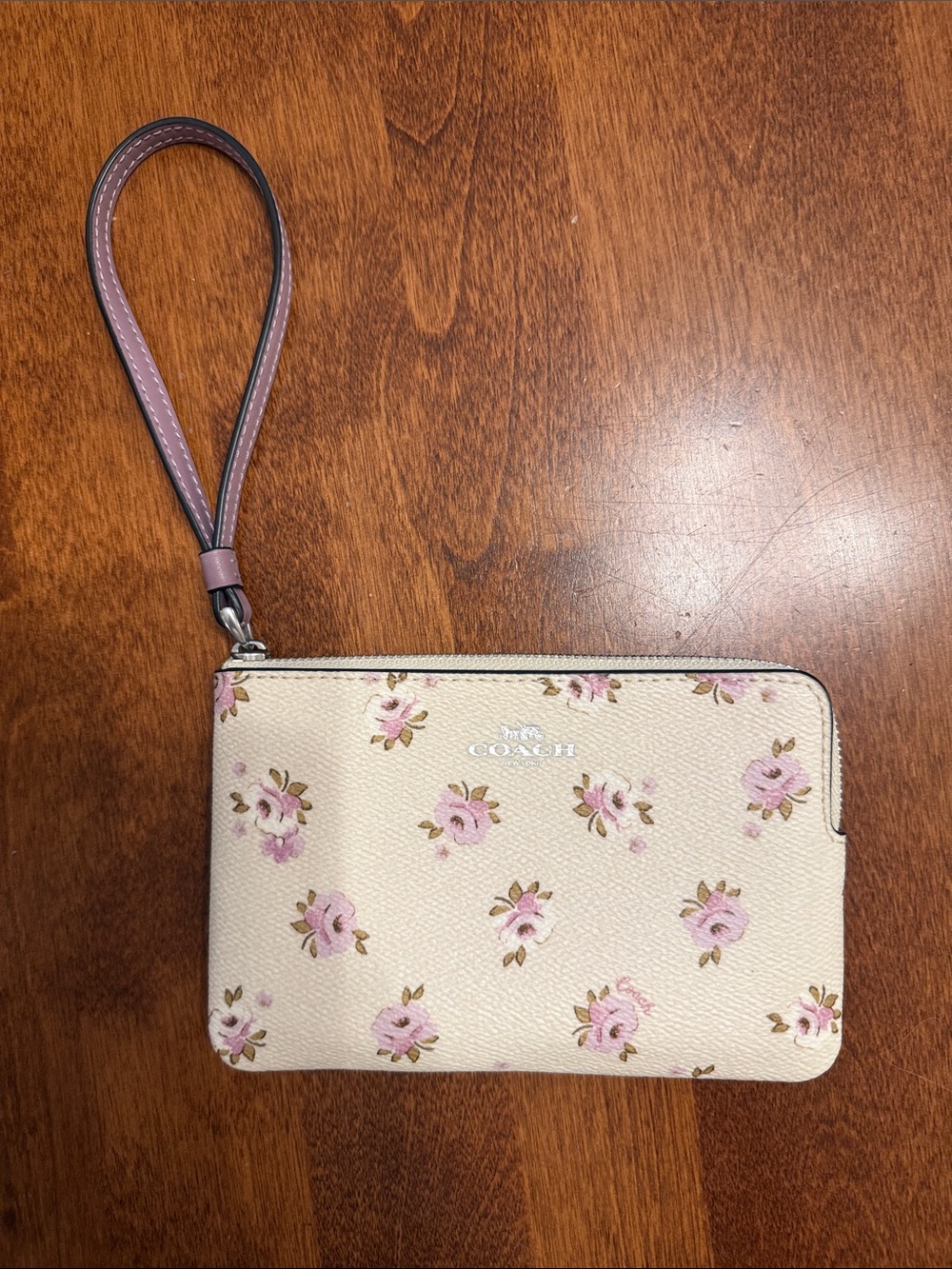 COACH Cream Floral Wristlet with Pink Strap